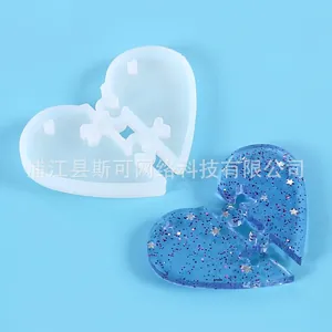 DIY heart-shaped puzzle silicone mold for crystal resin casting with a finished blue piece