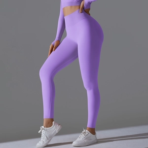 Purple seamless yoga set with long sleeve crop top and high waist leggings for fitness