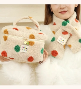 Detailed shot of soft plush makeup bag with colorful polka dots and matching scarf set