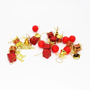 Detailed set of red and gold Christmas ornaments including gift boxes and mini drums
