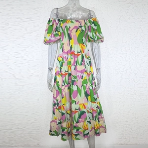 Detail of off-shoulder floral midi dress with elastic bust and layered cake skirt design
