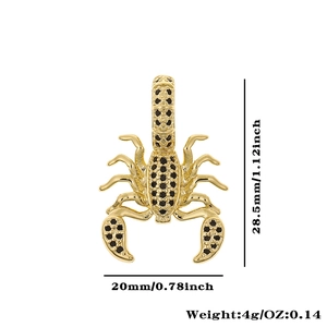 Detailed view of a gold scorpion pendant with black crystals showing 28.5mm height size