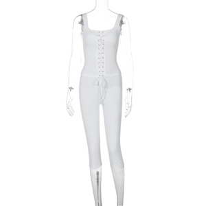 Detail of white ribbed knit set featuring metal eyelet lace-up front and slim fit fabric