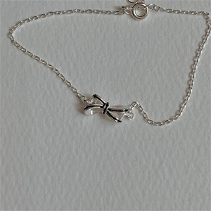 Elegant 925 sterling silver bow bracelet with black enamel outline for women