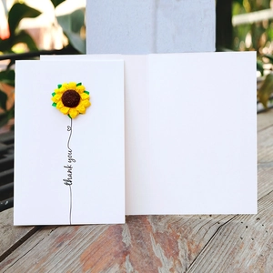 Minimalist white greeting card with 3D dried sunflower and thank you text on wood