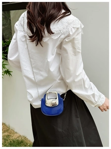 Mini blue patent leather crossbody bag with silver metal handle and chain shoulder strap