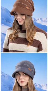 Close-up of knit winter bucket hat with Joyroad leather tag and striped texture detail