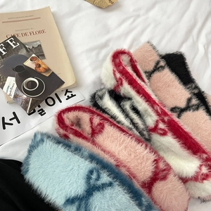 Faux fur skinny scarves with luxury monogram patterns in pink, red, and blue tones