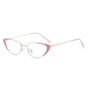 Fashionable cat eye glasses with gold metal frame and pink rhinestone accents