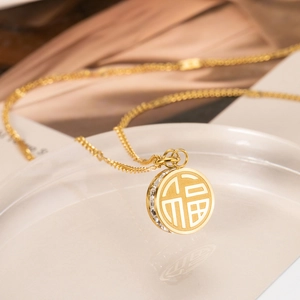 Titanium steel necklace with gold Fu character pendant and sparkling zircon stones