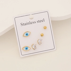 Detailed view of evil eye stud earrings set with zircon stones in stainless steel
