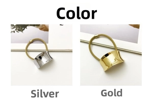Detail view of gold and silver concave metal buckles on premium elastic hair ties