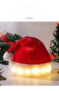 Detail of LED plush Christmas hat with warm white lights and festive holiday decor