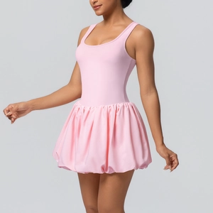Detailed back view of light pink athletic mini dress with a pleated skirt for tennis