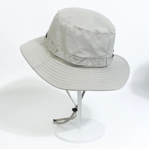 Detail showing breathable waterproof fabric and adjustable windproof cord on outdoor hat