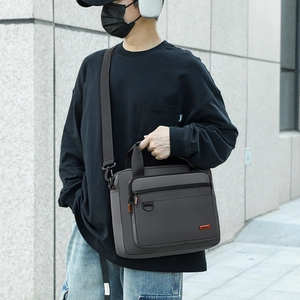 Dark grey business crossbody bag with adjustable strap and top handle for men