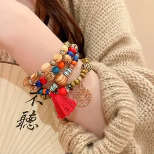 Bohemian multilayer sandalwood beaded bracelet with tree of life charm and red tassel