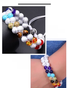 Detailed view of handmade double-layer braided bracelet with colorful chakra beads