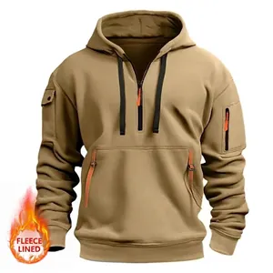 Detail of khaki pullover hoodie featuring utility sleeve pockets and cozy fleece lining
