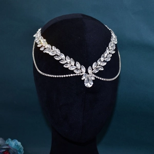 Handmade silver bridal headpiece with crystal rhinestones and leaf-shaped pendants