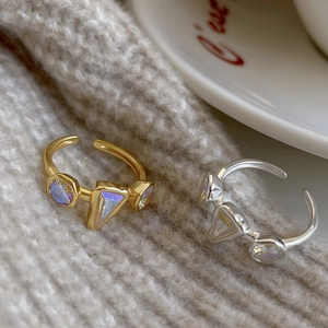 Macro shot of minimalist S925 sterling silver rings with iridescent zircon stones
