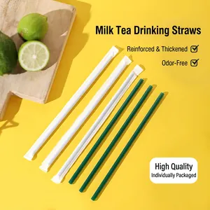 Individually wrapped green plastic straws for bubble tea and coffee on yellow background