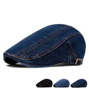 British denim newsboy cap with orange stitching and adjustable metal buckle in deep blue