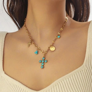 Gold-plated layered stainless steel necklace with turquoise cross and coin pendants