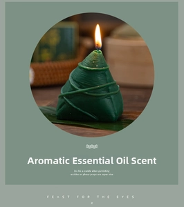 Macro shot of green Zongzi shaped aromatherapy candle with realistic leaf texture