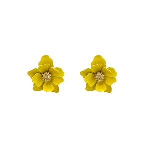 Macro shot of sweet yellow layered petal flower earrings with golden core details