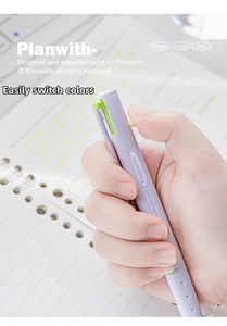 Close-up of hand holding a purple three-color triangular click pen over a notebook