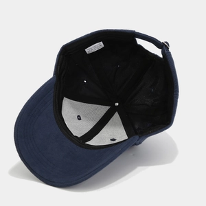 Detail of navy cotton baseball cap interior with wash label and stitching