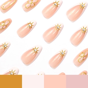 Pink almond press-on nails with 3D gold stars, floral patterns and sparkling rhinestones