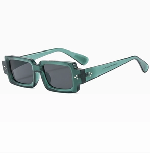 Macro detail of vintage green square frame sunglasses showing inner temple specifications