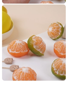 Detailed macro view of lifelike peeled orange candles showing realistic fruit textures