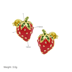 Detailed view of 14mm strawberry earrings featuring red enamel and green crystals