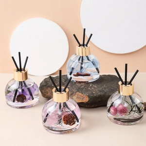 Car aromatherapy diffusers with preserved flowers and pine cones in glass bottles