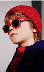 Close-up of stylish red round frame children's polarized sunglasses for a trendy sporty look