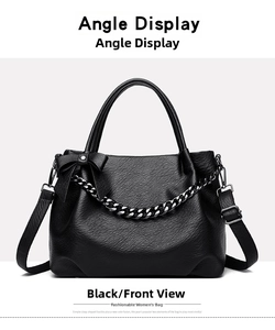 Detailed front view of black leather shoulder bag with chain and bow decoration