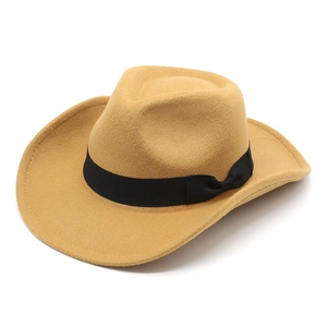 Detail of camel wool felt western cowboy hat featuring a black ribbon with a bow knot