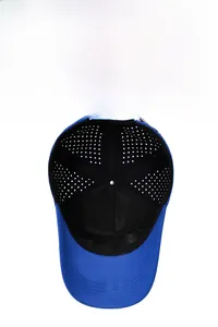 Close-up of breathable eyelets and premium fabric on a blue athletic baseball cap