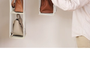 Detail view of a hanging closet organizer with multi-layer storage for handbags