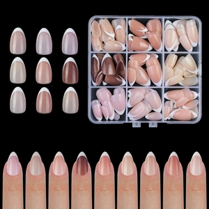 Detailed set of multi-colored almond french false nails in a plastic storage box