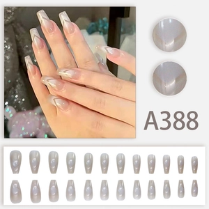Long nude gradient press-on nails with cat-eye shimmer and white V-shape French tips