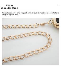 Close-up of elegant gold metal chain strap with glossy finish and secure ring hooks