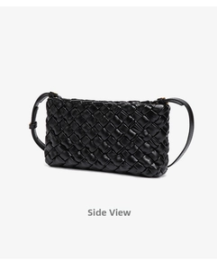 Macro side view of black woven leather shoulder bag with intricate Intrecciato pattern