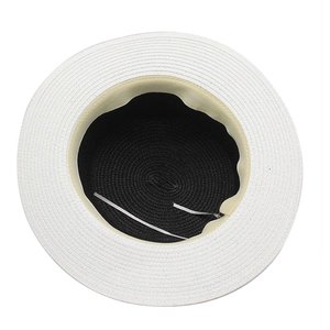 Flat top straw sun hat with black and white woven design and adjustable inner drawstring
