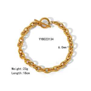 Detail view of 6mm gold stainless steel chain bracelet with OT toggle clasp and specs