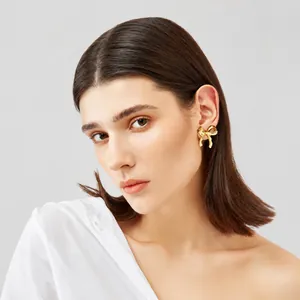 Elegant 18k gold plated bow stud earrings for women with minimalist butterfly design
