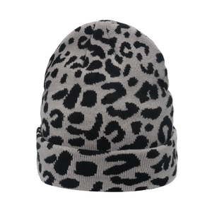 Close-up of high-quality grey and black leopard print knit pattern on a warm winter beanie